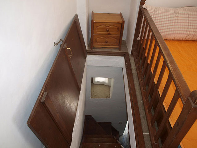 A wooden staircase for the upper storey
